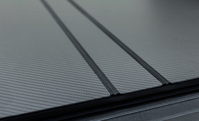 Access LOMAX 2022+ Rivian R1T 4ft 6in Bed (w/ OEM Tonneau Track) Folding Hard Cover - Carbon Fiber